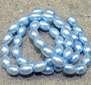 Glaspärlor klassiska risformade 6x8mm himmelsblå